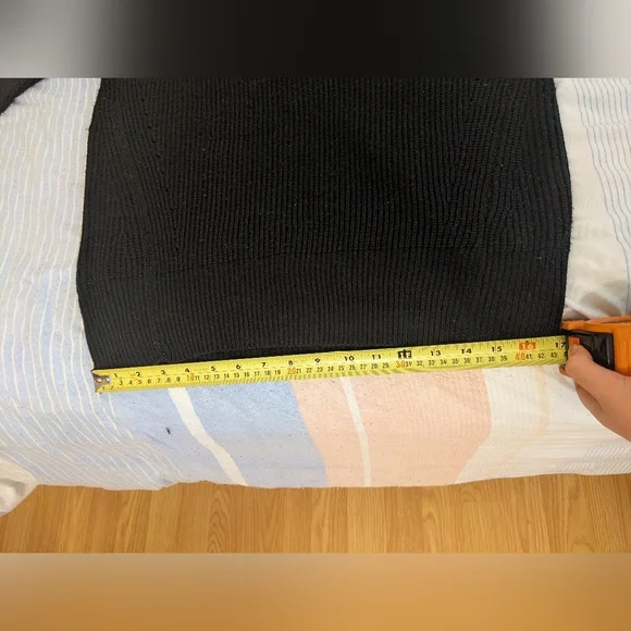 Black Off-the-Shoulder Sweater with Unique Cut-Out Neckline and Fitted Sleeves - Picture 6 of 9